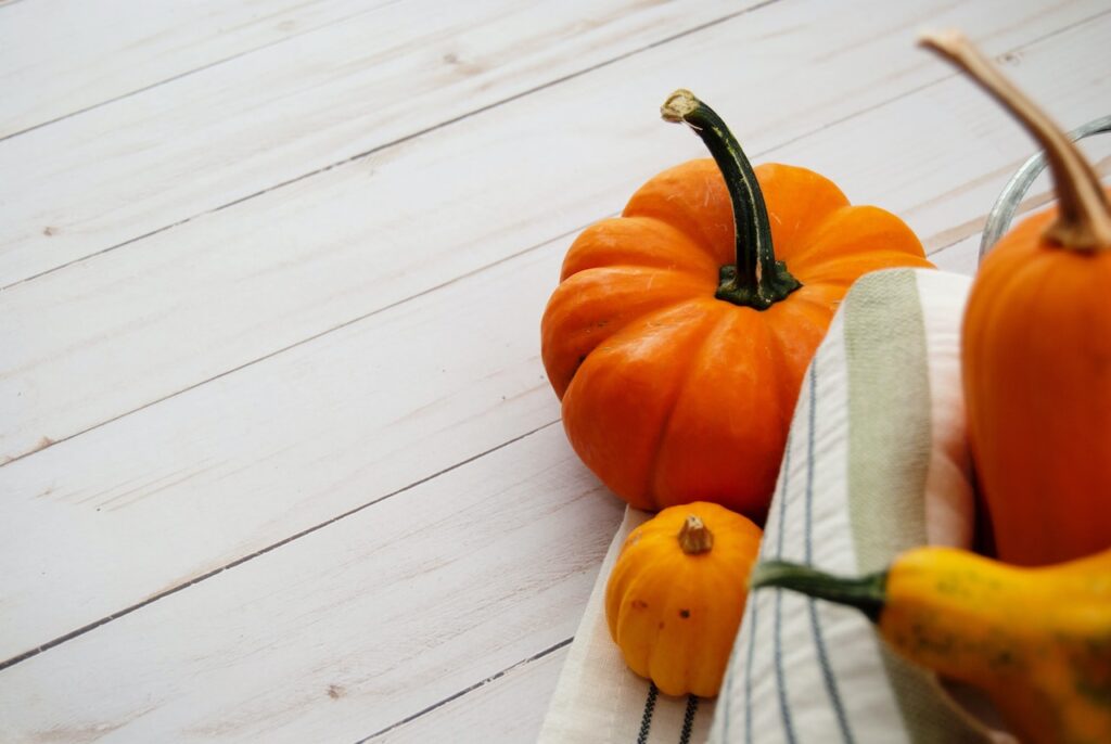 pumpkins on wooden surface